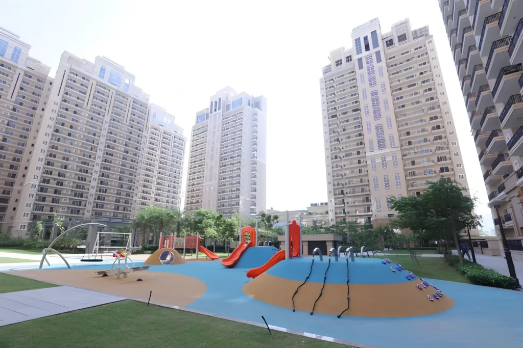 Outdoor playground and kids play area at Ace Parkway Noida with modern equipment