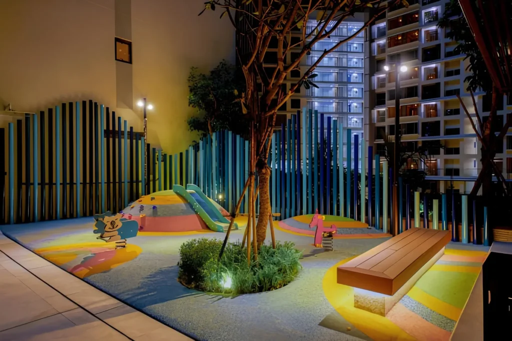 Outdoor playground and kids play area at The Peak M8 with modern play equipment