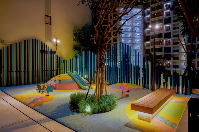 Outdoor playground and kids play area at The Peak M8 with modern play equipment