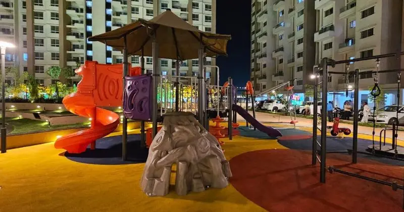 Children playing on a timber log natural outdoor play equipment installation